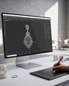 Computer monitor displaying jewelry design software with an earring on screen, in a modern office setting.